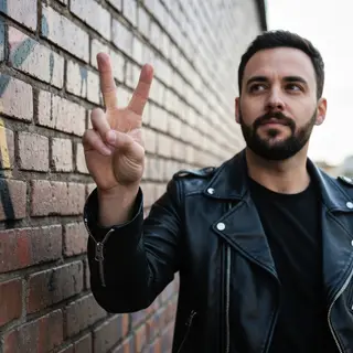 A person making a peace sign with their right hand, clearly 