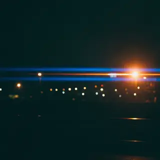 A cinematic frame with blue and orange anamorphic lens flare