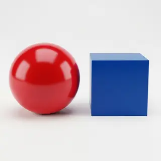 A red ball and a blue cube sitting side by side on a white s