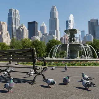 A city park with a park bench and pigeons in the foreground,