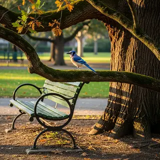 A bird perched on a branch, the branch extending from a tree