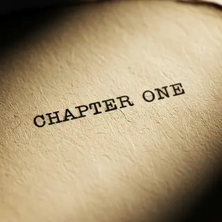 The word 'CHAPTER ONE' typed on aged paper with a vintage ty