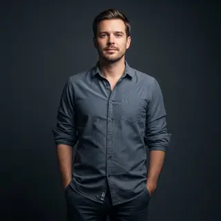 A man standing straight facing the camera, hands in pockets,