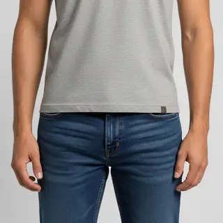 A person standing with both hands visible at their sides, fi