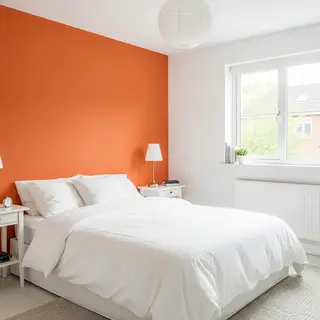 A bedroom wall painted in #FF6B35 (burnt orange) with white 