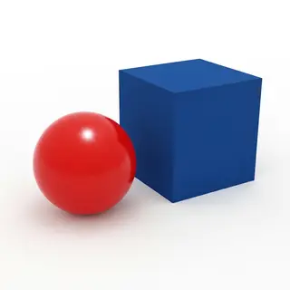 A red ball and a blue cube sitting side by side on a white s