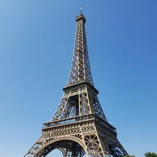 The Eiffel Tower in Paris on a clear day, architecturally ac