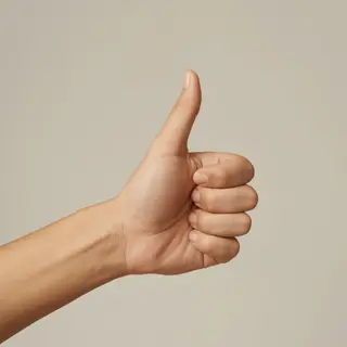 A hand giving a thumbs-up with four fingers curled and thumb