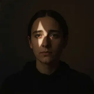 A portrait lit with classic Rembrandt lighting — triangle of