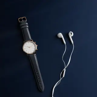 A product flat-lay on a #1A1A2E (deep dark blue) background,