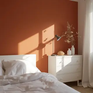 A bedroom wall painted in #FF6B35 (burnt orange) with white 