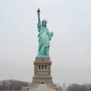 The Statue of Liberty on her island pedestal, with correct t