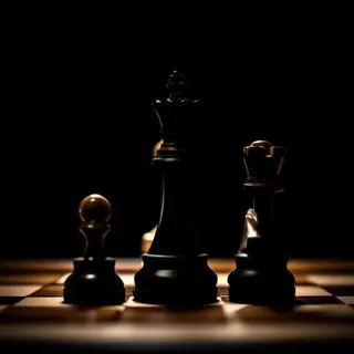 Five chess pieces on a board: a king in the center, a queen 