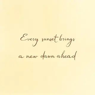 'Every sunset brings a new dawn ahead' written neatly on a p