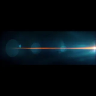 A cinematic frame with blue and orange anamorphic lens flare
