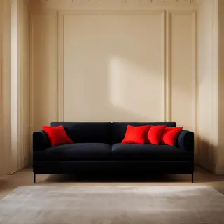 A minimalist room with walls in #F5E6CC (warm cream), a sofa