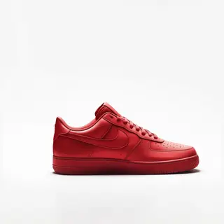 A single red sneaker on a clean white background with soft s