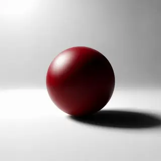 A red sphere on a white surface with a single shadow cast to