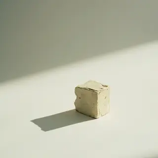 A still life painted in anxious minimalism — sparse composit