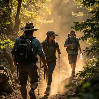 Three hikers on a trail: a man with a backpack and sunhat, a