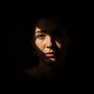 A portrait lit with classic Rembrandt lighting — triangle of
