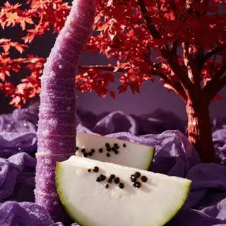 A purple carrot, a red tree with red leaves, and a white wat