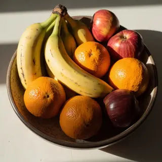 A fruit bowl containing exactly 3 bananas, 4 oranges, and 2 