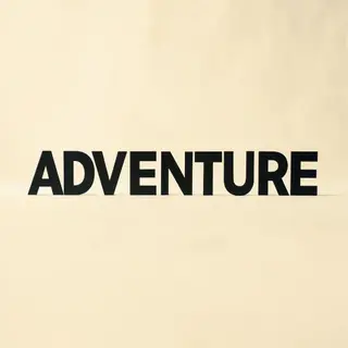 The word 'ADVENTURE' in big bold letters centered on a plain
