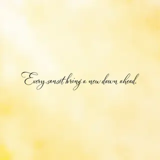 'Every sunset brings a new dawn ahead' written neatly on a p