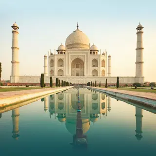 The Taj Mahal in Agra seen from the reflecting pool, with ac