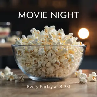 A movie night poster with a large popcorn image in the cente