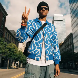 A person making a peace sign with their right hand, clearly 