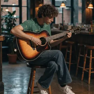 A person playing an acoustic guitar with left hand on the fr