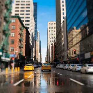 A tilt-shift photograph of a city street making real-life lo