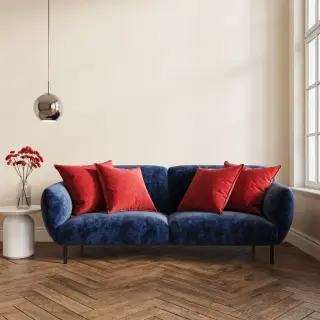 A minimalist room with walls in #F5E6CC (warm cream), a sofa