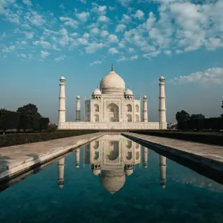 The Taj Mahal in Agra seen from the reflecting pool, with ac