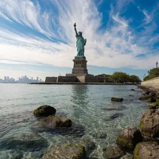 The Statue of Liberty on her island pedestal, with correct t