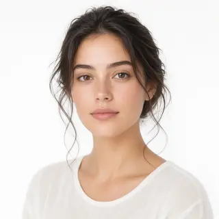 A high-key portrait of a person against a bright white backg