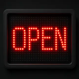 The word 'OPEN' displayed on a red LED sign with glowing pix