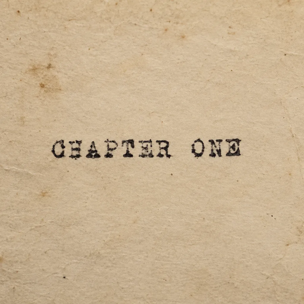 The word 'CHAPTER ONE' typed on aged paper with a vintage typewriter font, complete with slightly uneven ink